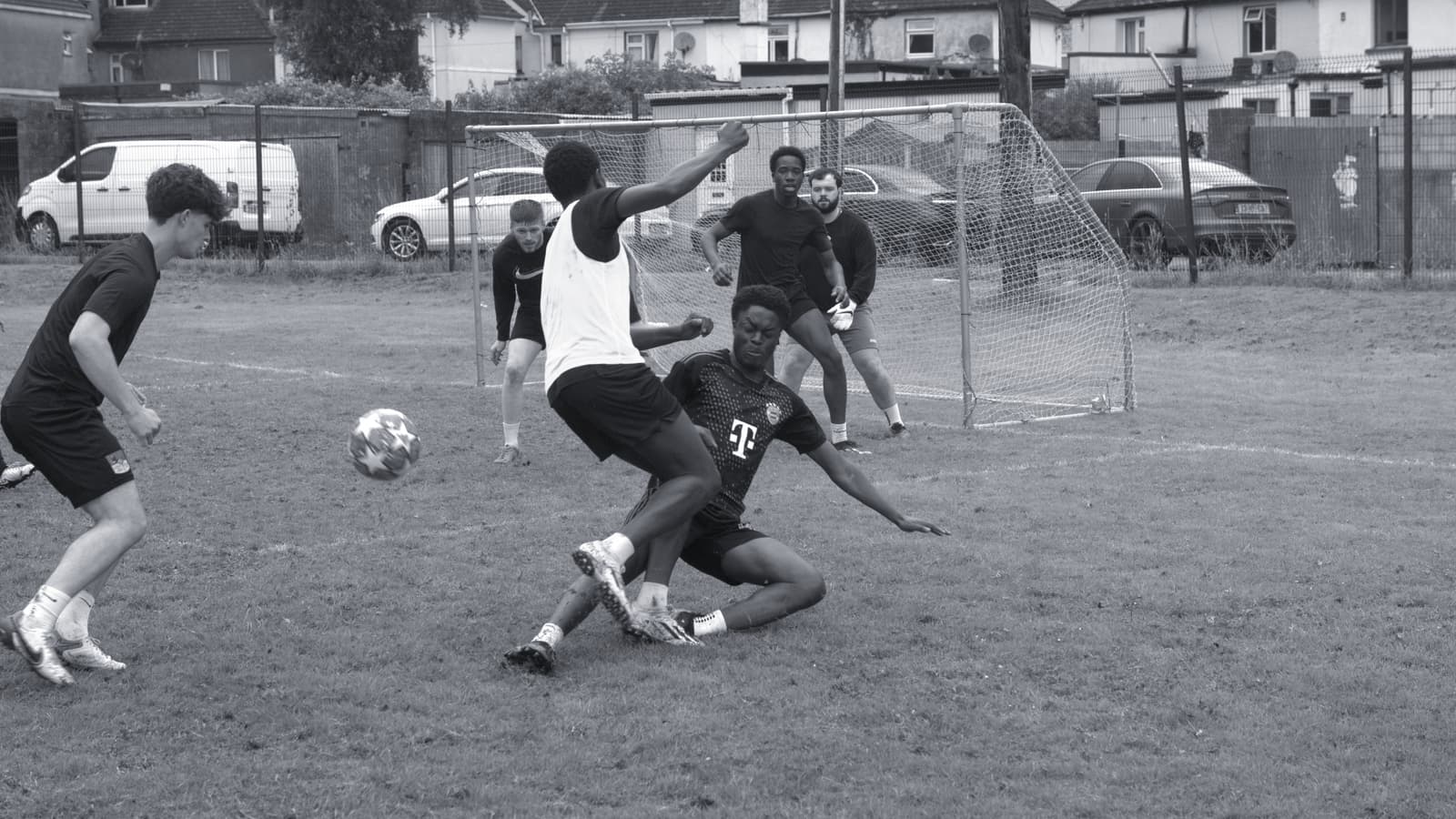 Goalmouth scramble at the 2024 Athlone's Finest tournament, a sliding challenge in front of goal
